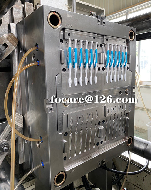 Multi-cavity toothbrush two shot rotary shafe mold